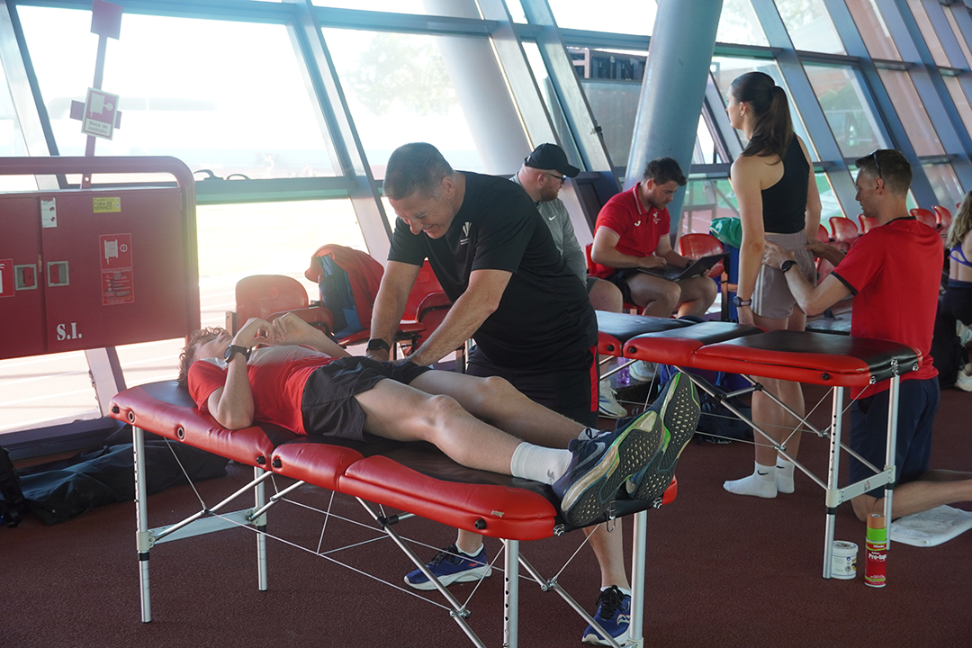 Dave and Adam providing physio treatment to George and Abi in Portugal Warm Weather Training Camp