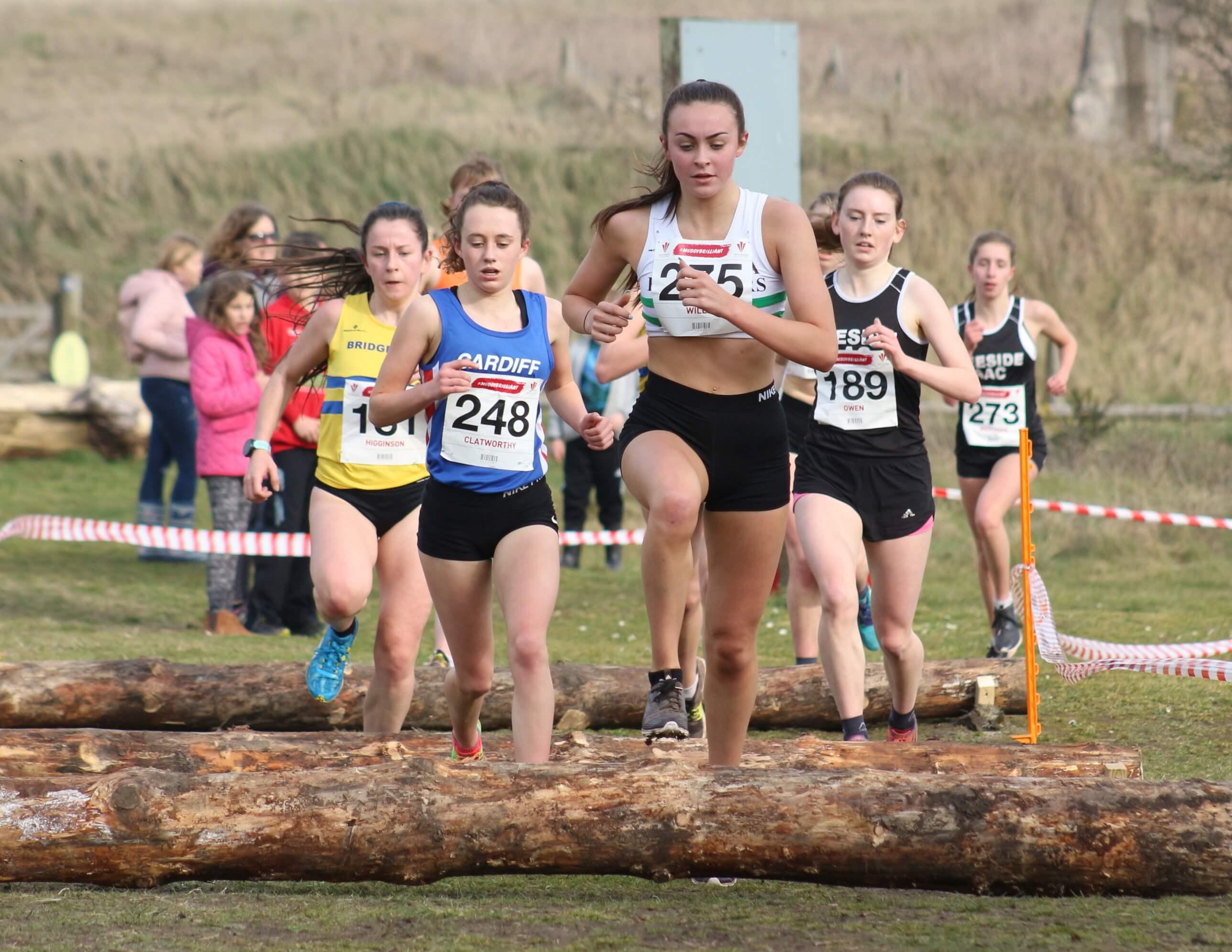 Swansea Harrier Ashleigh Willis negotiates the log barriers on her way to victory in the women's under-17-under-20 race..jpg