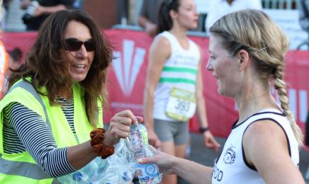 Volunteers handing out water after the race ..jpg