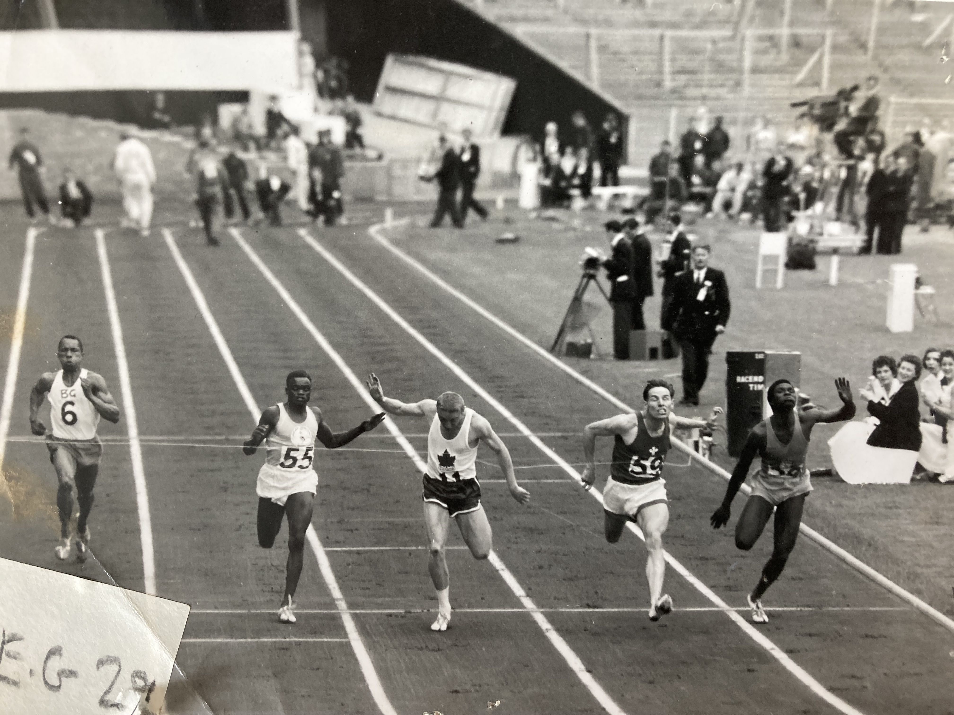 Ron wins first heat of 100y at 1958 Empire Games.jpg