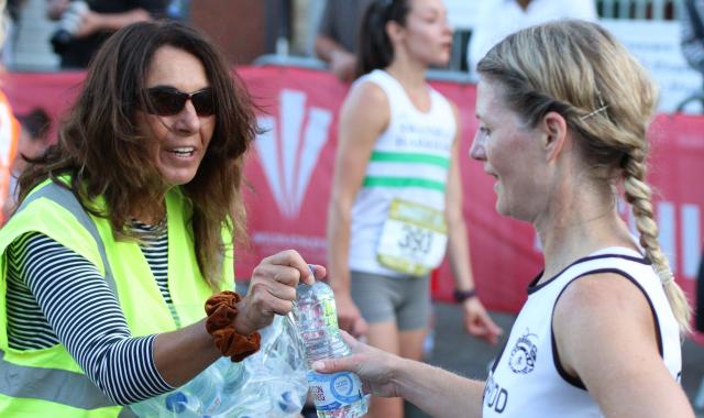 Volunteers handing out water after the race ..jpg