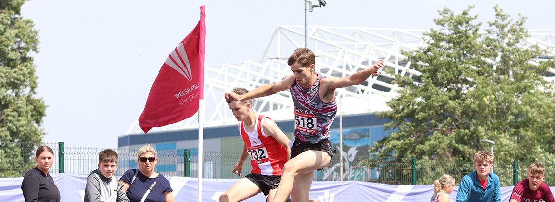 Athletes competing in the steeplechase.